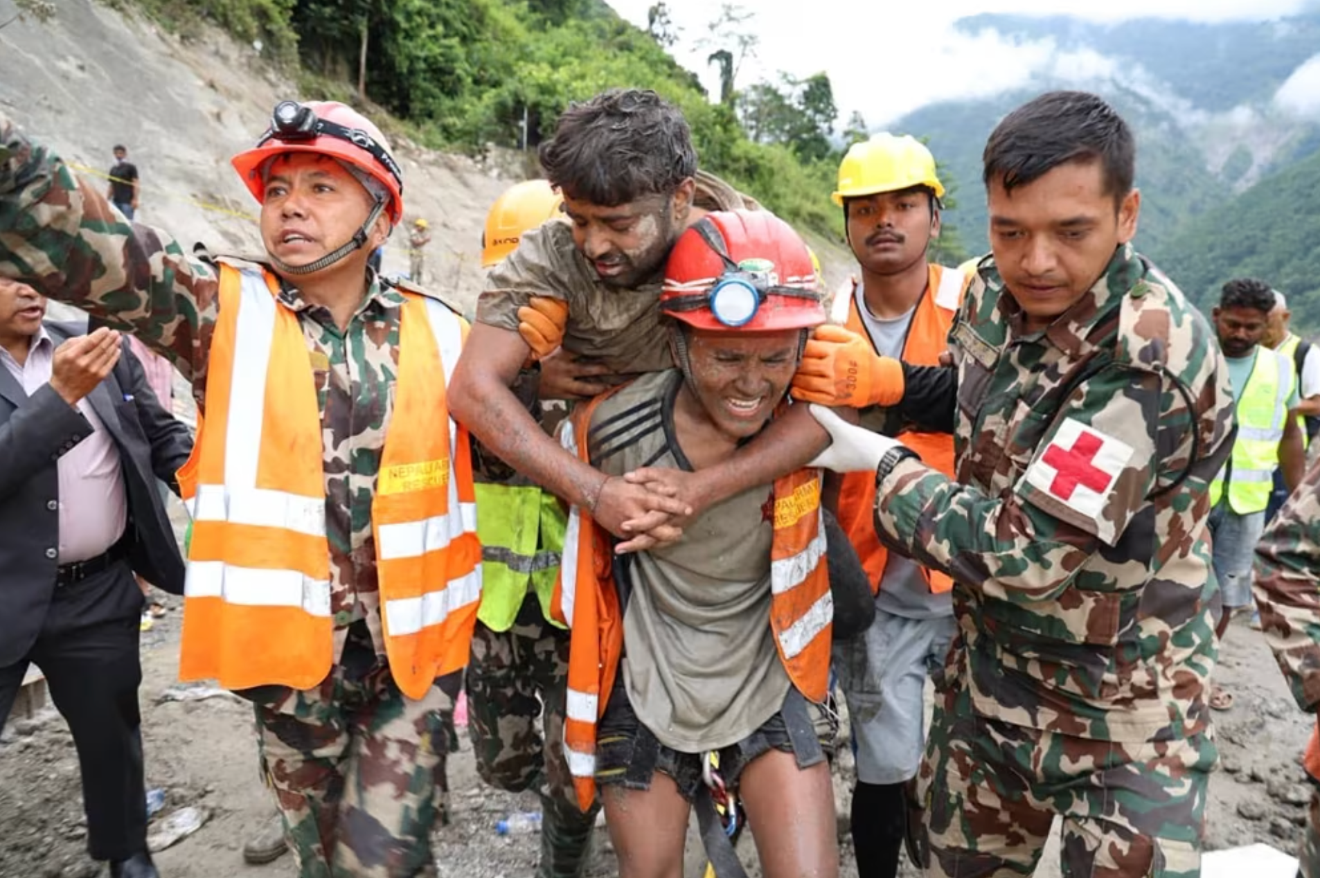 Two trapped workers are pulled alive from Nepal tunnel more than a week after deadly floods