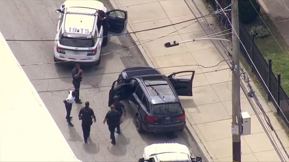 Woman crashes SUV into highway patrol officer, Philly police say