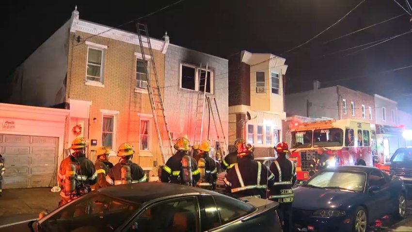 Fire crews respond to a rowhome fire along D Street in Philly's Fairhill community early Sunday.