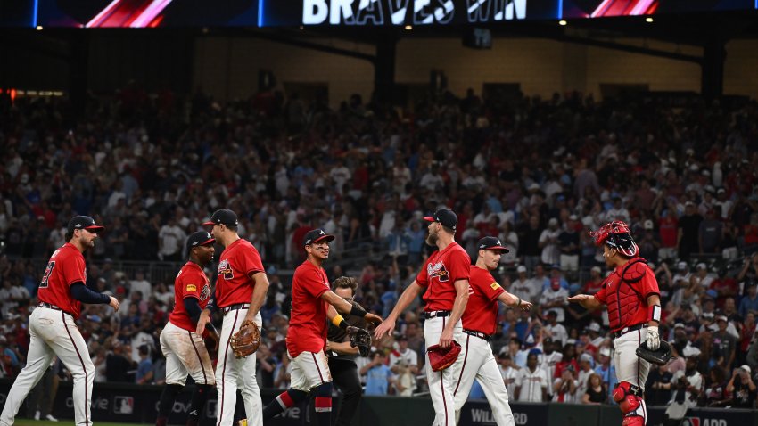 ATLANTA, GEORGIA – OCTOBER 01: Austin Riley #27, Ozzie Albies #1, Matt Olson #28, Mauricio Dubón #14, Chris Sale #51, Mike Yastrzemski #18 and Drake Baldwin #30 of the Atlanta Braves  celebrate after defeating the Philadelphia Phillies  in game three of the National League Wild Card Series at Truist Park on October 01, 2026 in Atlanta, Georgia. (Photo by Edward M. Pio Roda/Getty Images)