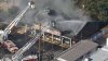 Firefighters work to extinguish flames at South Jersey 7-Eleven